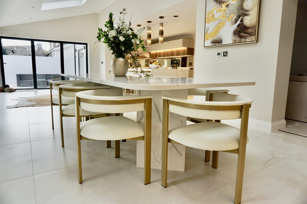 Stone Tables & Staircases — Calacatta marble pedestal dining table with waterfall edge — Cowbridge