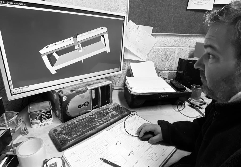 Craftsperson reviewing CAD technical drawings for kitchen worktop design